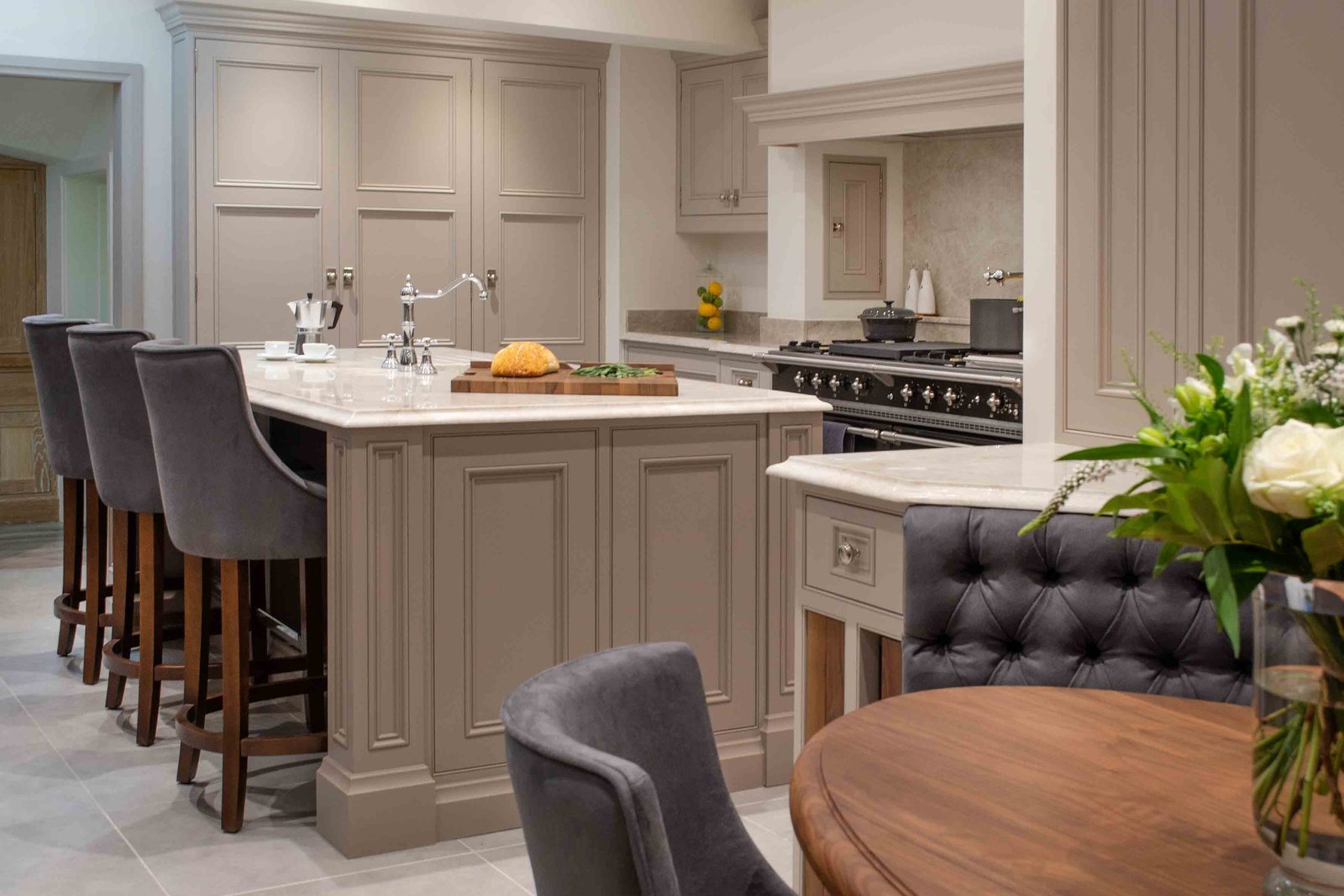 Bespoke kitchen island and dining space showcasing The Chair People furniture